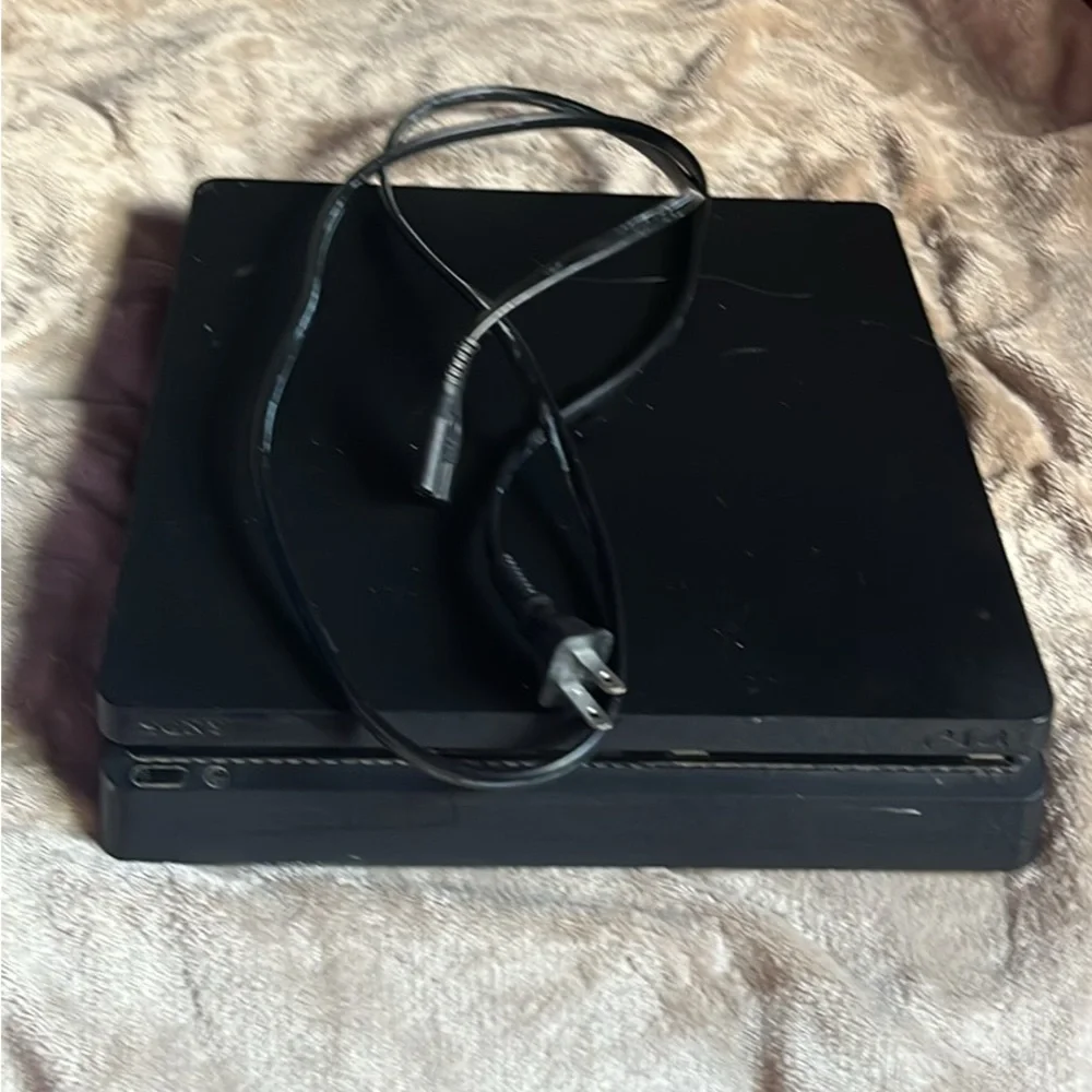 Sony PlayStation 4 Console with games and controllers